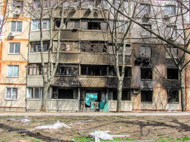Kharkiv, Kharkov, Ukraine - 05.07.2022: burnt destroyed after fire bombing civilian building apartment with broken windows balconies result rocket strike shelling Ukrainian russian war destruction