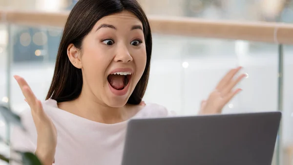 Korean Asian woman with laptop luck excited surprised feels very happy got university scholarship win online auction victory winning emotion female winner celebrate triumph scream with joy achievement — Stockfoto