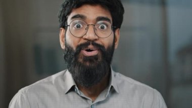 Male portrait surprise emotion enthusiastic surprised shocked arabian amazed man in eyeglasses make big eyes indian businessman winner demonstrate wow emotion face expression say wow happiness triumph