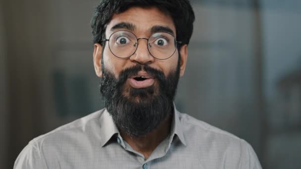 Male portrait surprise emotion enthusiastic surprised shocked arabian amazed man in eyeglasses make big eyes indian businessman winner demonstrate wow emotion face expression say wow happiness triumph — Stock video