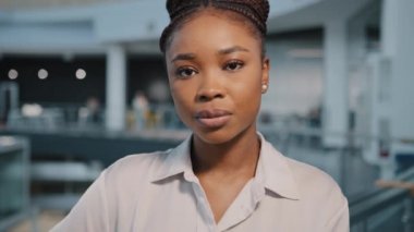 Close-up serious pensive sad business woman portrait. Headshot African American girl biracial female entrepreneur manager lawyer bankrupt fired lady calm boss worker looking at camera indoors close up