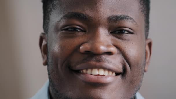 Headshot smiling young african american man happy millennial male model cheerful looking at camera handsome guy feeling confident posing with perfect healthy toothy smile close up face view portrait — ストック動画