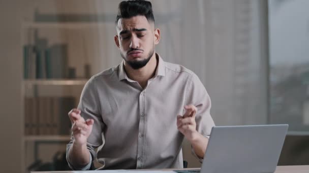 Frustrated hispanic young guy business man in office sadness accountant stressed about bank loan payments mistake in financial report document cross fingers pray say prayer hopes for good luck wishes — Video