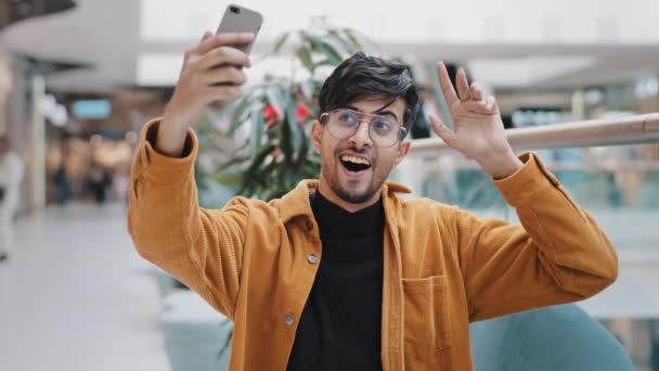 Young Happy Indian Guy Blogger Holds Smartphone Recording Vlog Filming — Vídeo de Stock