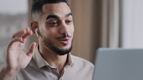 Smiling Hispanic Man Arab Guy Wears Wireless Earphones Using Electronic — Stockvideo