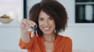 African American happy woman holding key buying own home real estate. Female realtor apartment agent selling property make offer of dwelling. Biracial curly girl enjoy moving relocation day thumb up