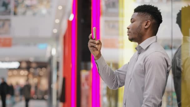 Young Male Blogger Holding Phone Taking Pictures Using Mobile Application — Video Stock