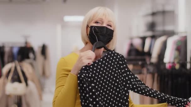 Happy Mature Woman Protective Mask Clothing Store Joyful Female Customer — Video