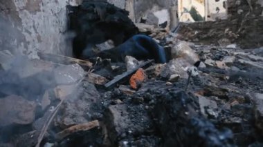 Kharkiv Kharkov region, Skovorodinovka, Skovorodinivka, Ukraine - 05.07.2022: deboned walls ruins smoking debris ash smoke Russian air missile destroyed historical museum war terrorism rocket attack