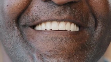 Extreme close up human wrinkled male face healthy african american senior man with white toothy smile clean teeth smiling ethnic adult patient dentist advertising stomatology services dental procedure