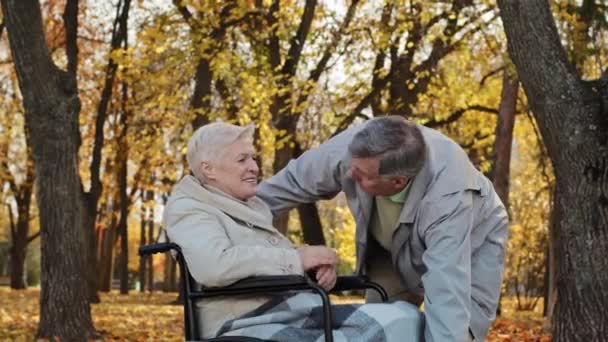 Caucasian Senior Man Holding Female Hand Caring Woman Disability Wheelchair — 图库视频影像