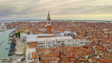Old bewitching city standing on water beautiful aerial view of famous popular Piazza San Marco historical landmark main square in Venice famed tourist place historical architecture Italy slow motion