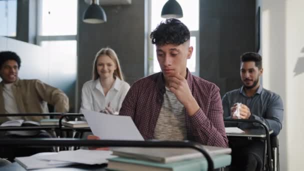 Upset Distressed Hispanic Male Student Sitting Desk Classroom Alone Feels — Αρχείο Βίντεο