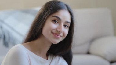 Charming beautiful young arab hispanic 20s student woman girlfriend looking at camera posing at home. Close up portrait pretty lady with stylish attractive appearance perfect clear skin beauty concept