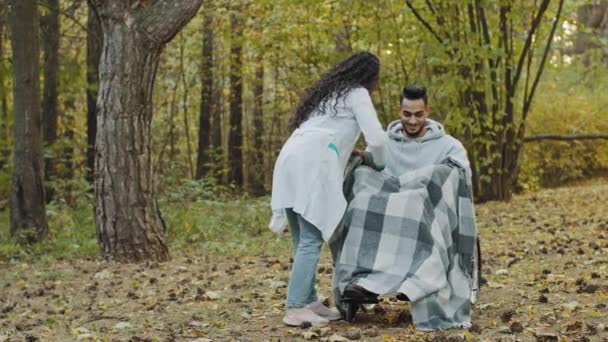 Young Nurse Medical Gown Covers Guy Warm Blanket Takes Care — Vídeo de stock