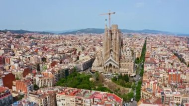 Top view stone concrete monumental church in Spain Barcelona La Sagrada Familia temple unfinished religious building architectural structure neo-Gothic art city landscape panorama travel to Europe