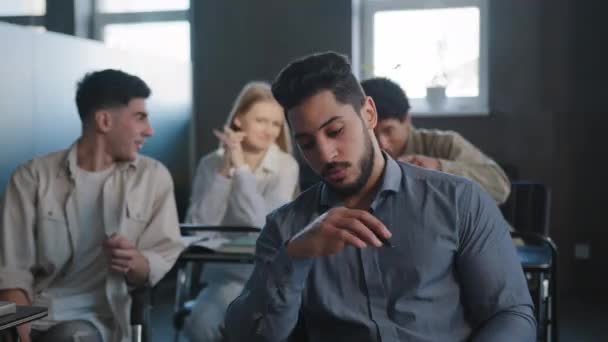 Sad Frustrated Arab Student Sitting Class Desk Alone Suffering Mistreatment — Stockvideo