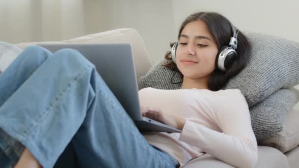 Relaxed Arabian Woman Freelancer Female Student Browsing Networks Lying Sofa — Vídeo de Stock