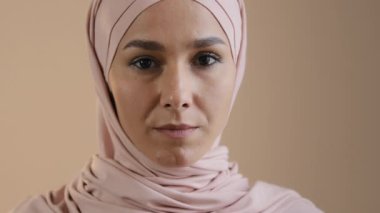 Close-up face young woman in hijab with natural make up muslim girl smiling looking at camera satisfied with services of dental clinic portrait happy islamic arab female laughing healthy white teeth