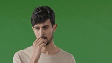 Portrait of nervous serious hispanic young man feel stressed worried desperate arab guy thinking about problems frustrated failure at work close up pensive sad male concerned unemployment biting nails
