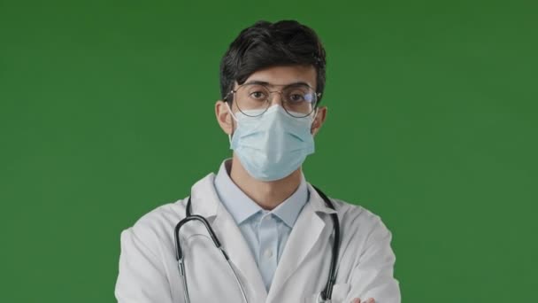 Portrait Young Guy Doctor Studio Green Background Serious Hispanic Man — Video