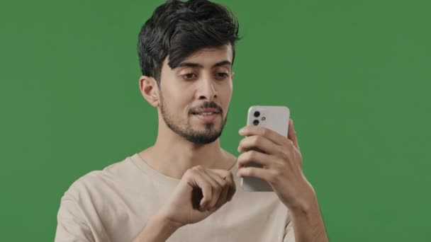 Portrait Close Arabian Young Man Studio Green Background Holding Phone — 비디오