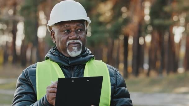 Mature Concentrated Forestry Engineer Technician Forester Protective Helmet Stands Park — Stock Video