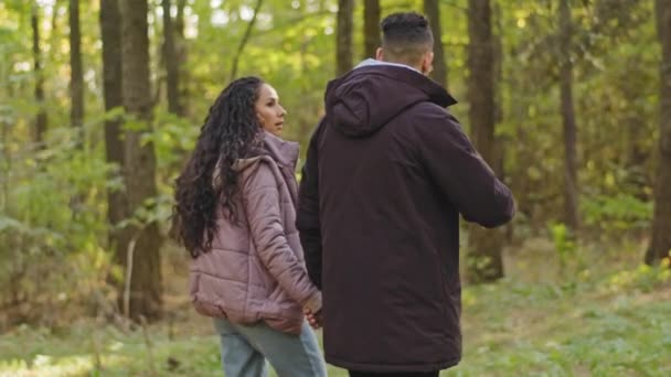 Back View Young Loving Carefree Joyful Hispanic Couple Walks Autumn — Vídeo de Stock