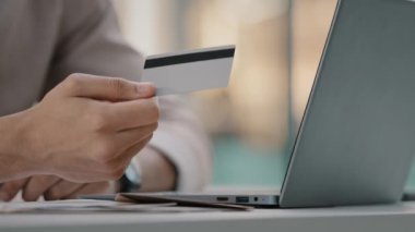 Unknown people in bank using cashless payment. Close up male hands give credit card to woman client of financial service paying technology shopping e-commerce buying electronic money cyber finance