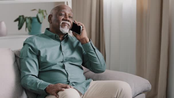 African Bald Middle Aged Man Senior Mature Businessman Sitting Sofa – Stock-video