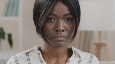 Female portrait close-up sad face upset young african american woman excited serious frustrated girl model with offended expression looking at camera posing indoors worry about trouble problem stress