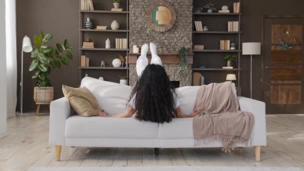 Carefree Happy Young Woman Falls Comfortable Sofa Living Room Funny — Stockvideo
