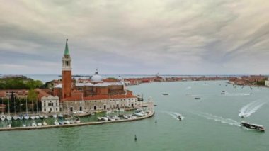 Aerial view panoramic shot coastline busy port seafaring historical attractions city Venice in Italy Doges Palace famed San Marco public square Piazza architecture landmark famous tourist destination