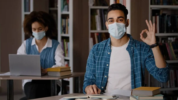 Young Clever Guy Student Protective Mask Writes Notes Prepares Exam — Fotografia de Stock