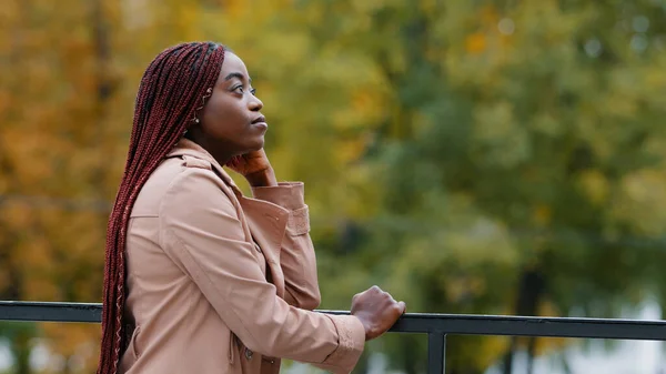 Thoughtful Pensive Upset Young Woman Stands Outdoors Looking Side Thinks — Stockfoto