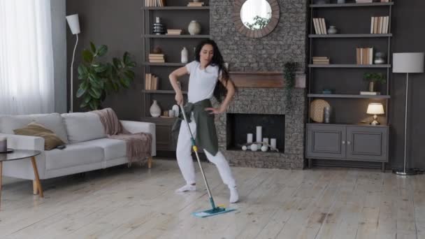 Energetic Happy Young Woman Housewife Mopping Floor Living Room Performs — 图库视频影像