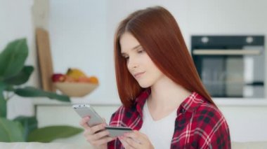 Sad 20s user shopper consumer make financial operation with credit card on mobile phone enter numbers use banking app invest economics female client worried error mistake in e-banking not enough money