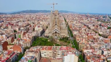 Arial view drone shooting cathedral temple Expiatori La Sagrada Familia in Barcelona in old town church in Catalonia, Spain. Go everywhere architectural masterpiece of Gaudi in sunrise city panorama
