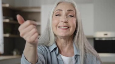 Female portrait caucasian granny old mature hospitable woman gray-haired smiling welcoming homeowner friendly tempting housewife lady asking come here invitation gesture welcome sign appealing to join