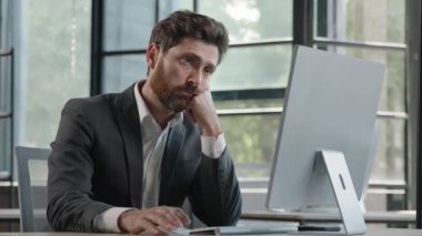Tired lazy napping yawn adult bearded man male manager worker bored at work project online in computer in office Caucasian mature ill businessman need energy asleep feel overworked exhaustion syndrome