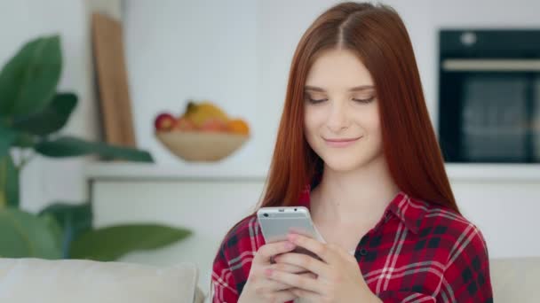 Smiling Red Haired Caucasian Girl Model Woman Sits Kitchen Room — Vídeos de Stock