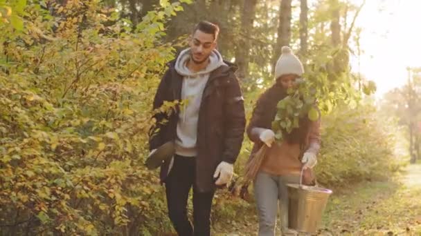 Young Couple Happy People Walking Autumn Park Talk Eco Activists — Stock video