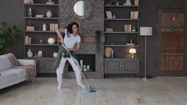 Young Energetic Woman Housewife Cleans Home Mopping Floor Living Room — 图库视频影像