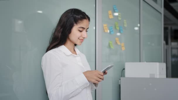 Young Woman Employee Manager Stands Office Consulting Client Internet Using — Video