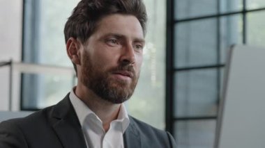 Smiling bearded businessman making conference video chat laptop computer in office Caucasian male professional call center agent hr manager having distance webcam talk job interview training webinar
