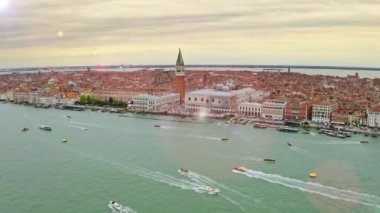 Amazing view from above huge wide water channel busy tourist or shipping port boats ships long coastline lively waterfront old historical European city Venice Italy famous tourist destination. High