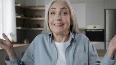 Portrait of caucasian retiree granny woman old lady unsure shrugging shoulders making doubt gesture no question answer doesnt know. Gray-haired female model looking with uncertain puzzled expression
