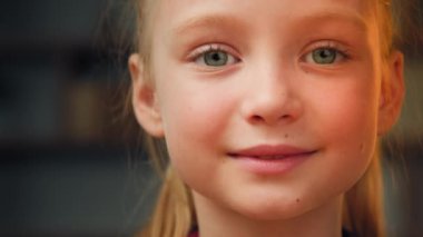 Portrait cute caucasian little preschool girl daughter toddler pretty talented kid friendly female face beautiful blonde baby with green eyes smiling looking at camera happy small child enjoy holidays