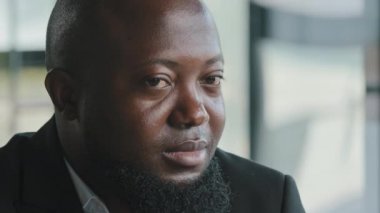 Happy satisfied glad african american male businessman plus size face bearded adult man with dark skin employee worker educator smiling white healthy toothy smile stare turning head looking at camera