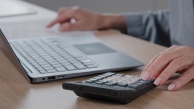 Close up female hands with manicure wrinkled unrecognizable senior woman cashier accountant calculate financial data pay online bills on computer planning budget managing bank finances costs economy